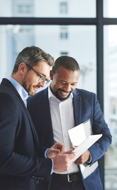 Hington Klarsey: two male executives discussing business