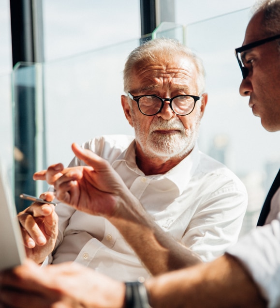 two businessmen discussing affairs during meeting