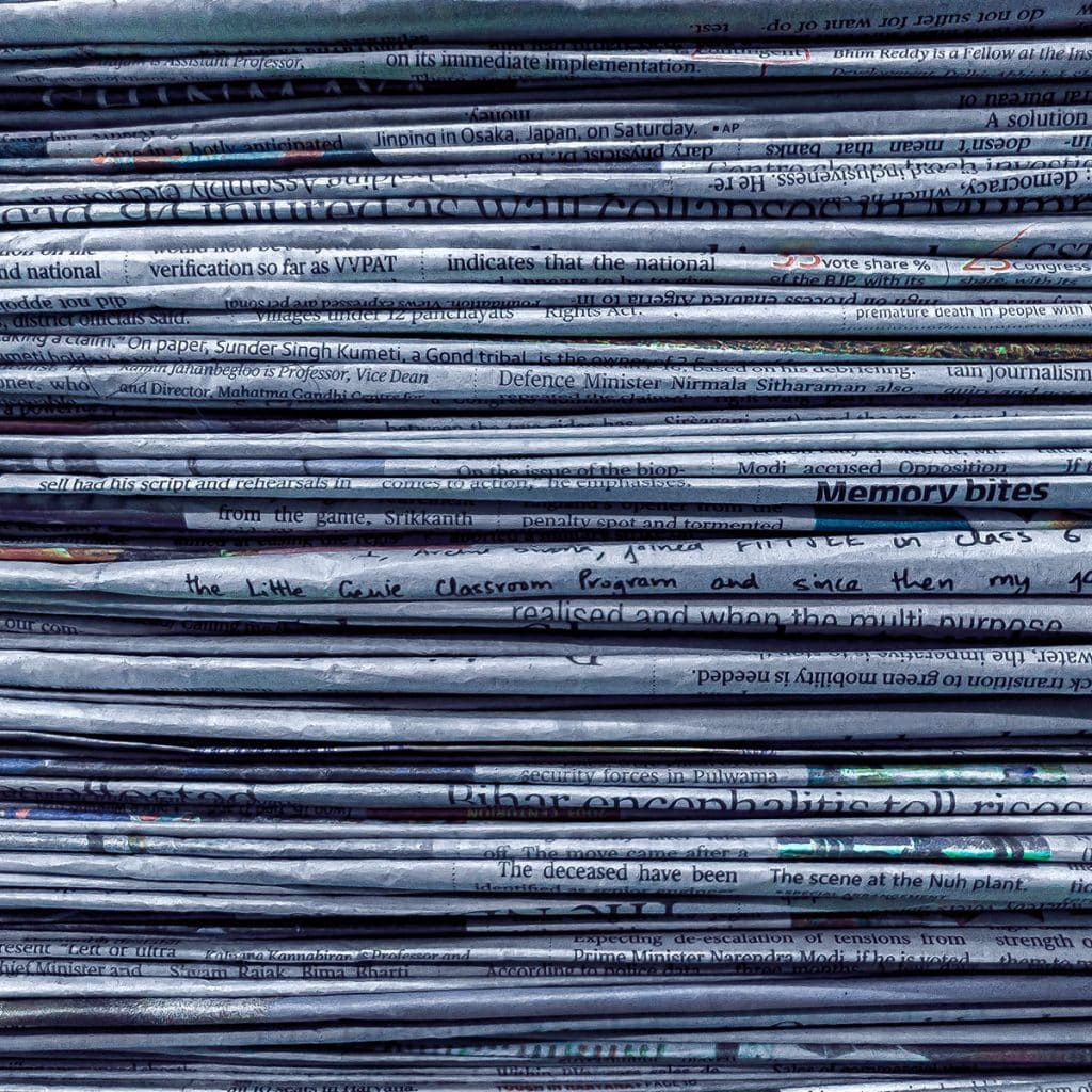 Hington Klarsey: stack of newspapers