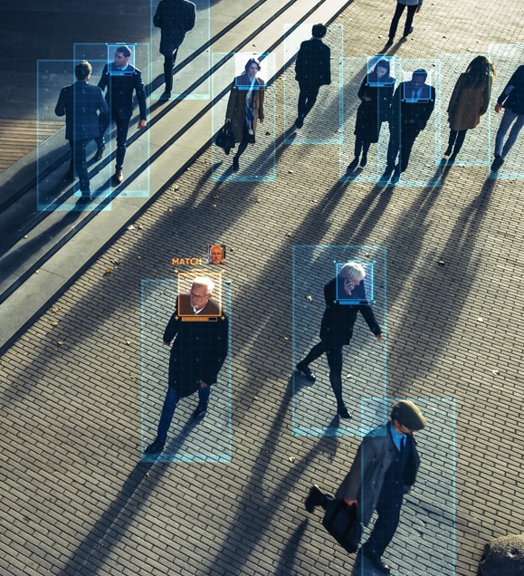 Hington Klarsey: crowd walking on sidewalk subject to face recognition screening