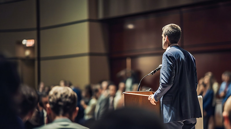 Hington Klarsey: male politician addressing the audience